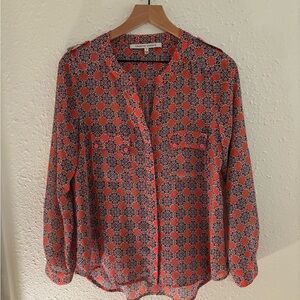 Long sleeve, lightweight coral and navy paisley blouse.